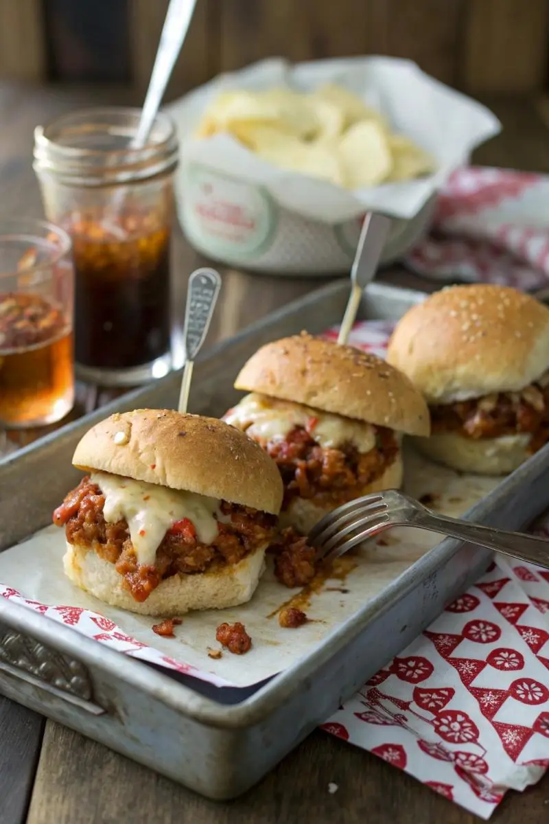 cajun chicken sloppy joe sliders with cheese on tray